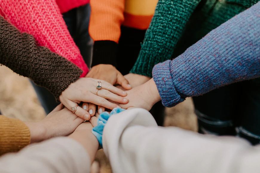 image of people holding hands