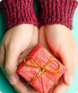 photo-of-hands-holding-a-gift